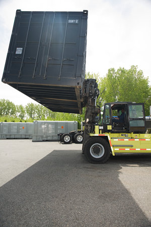 Forklift truck lifting cargo containerのeditorial素材
