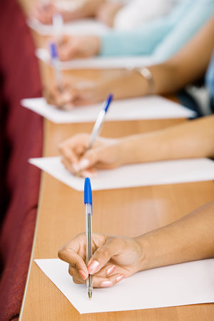 Students taking notesの写真素材