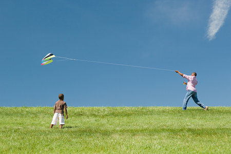 Father and son with kiteの写真素材