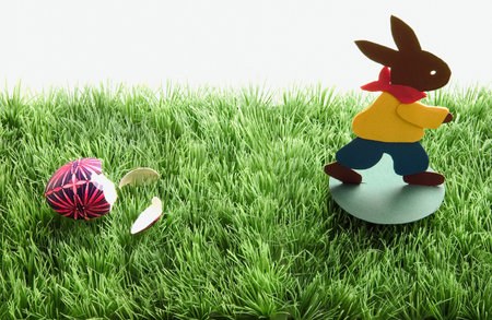 Easter bunny running from eggの写真素材