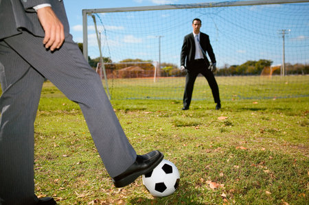 Businessman taking a penaltyの写真素材