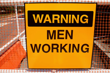 Warning men workingの写真素材