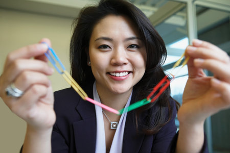 Woman holding paperclips