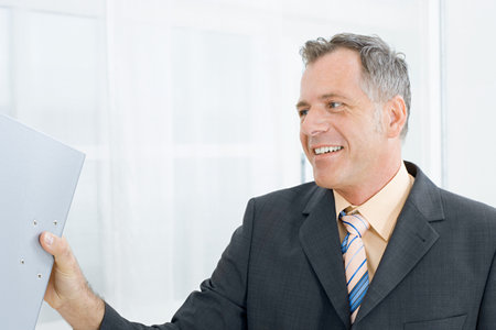 Businessman with ring binderの写真素材