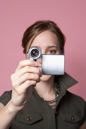 Woman with a video cameraの写真素材