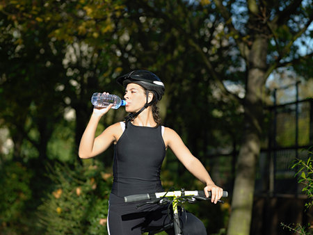 Cyclist drinking waterの写真素材