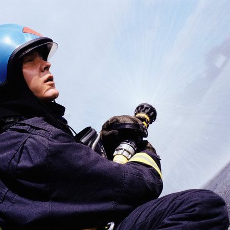 Fireman operating hose
