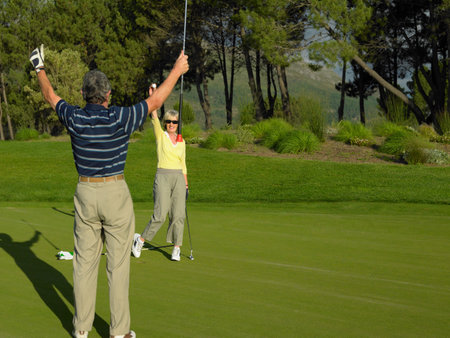 Couple playing golfの写真素材