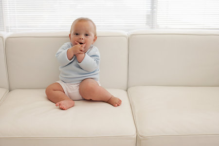 Baby on a sofaの写真素材