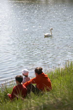Family by a lakeの写真素材