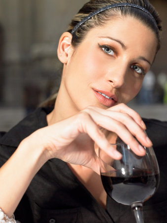 Woman with a glass of wineの写真素材