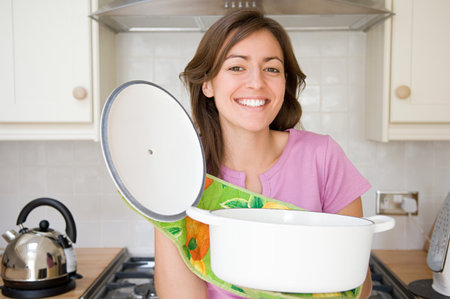 Woman holding casserole dishの写真素材