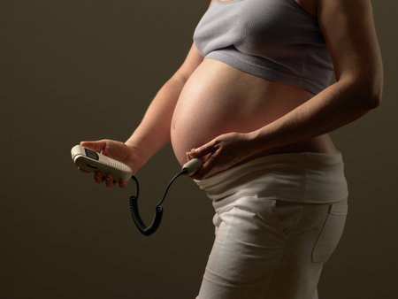 Pregnant woman checking babys pulseの写真素材