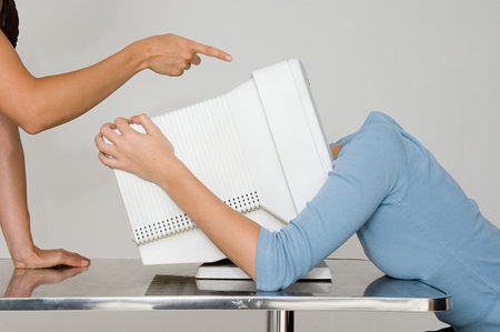 Woman with head inside computer monitor