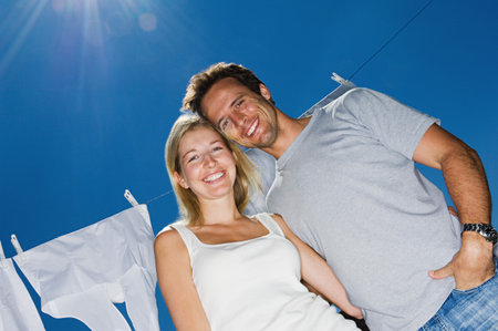 Couple by washing lineの写真素材