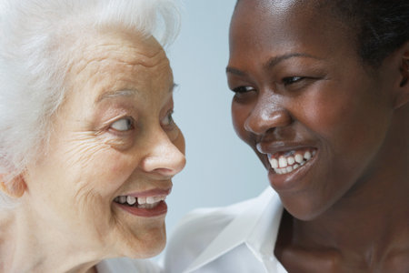 Head shot of senior woman and young womanの写真素材