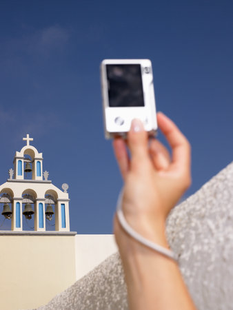 Woman's hand taking a pictureの写真素材