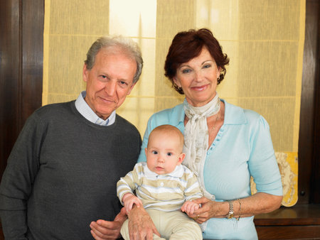 Senior grandparents with baby grandson