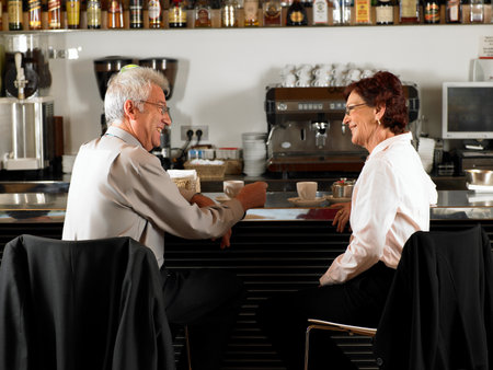 Businesspeople at a bar drinking coffee.の写真素材
