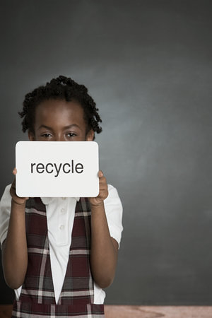 Girl with sign saying recycleの写真素材