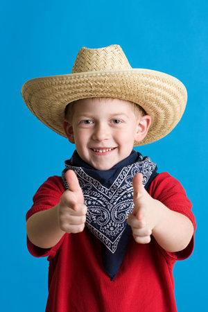 Boy dressed as cowboyの写真素材