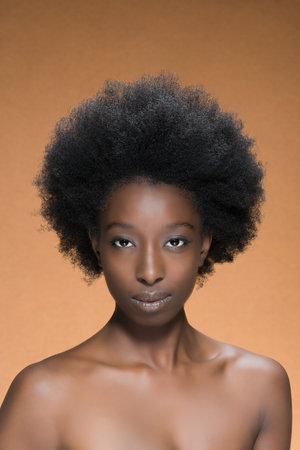 Portrait of a woman with afro hairの写真素材