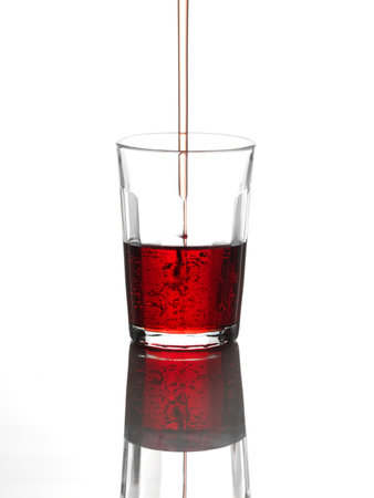 Pouring drink into glassの写真素材