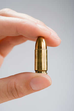 hand holding a bullet