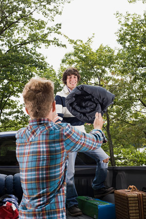 Friends with camping equipment