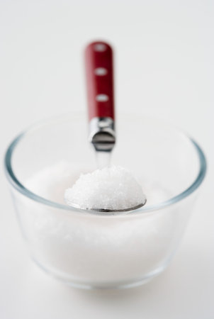 a spoonful of sugar in a bowlの写真素材