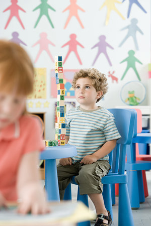 Boy playing with building blocksの写真素材