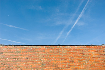 Brick wall and the blue skyの写真素材