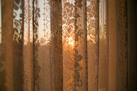 Sunlight through net curtainの写真素材