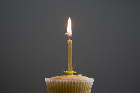 Birthday cupcake with candle on topの写真素材