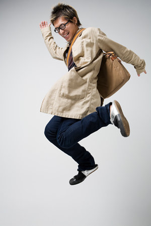Japanese man jumping for joyの写真素材
