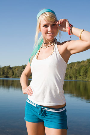 Woman standing near a lakeの写真素材