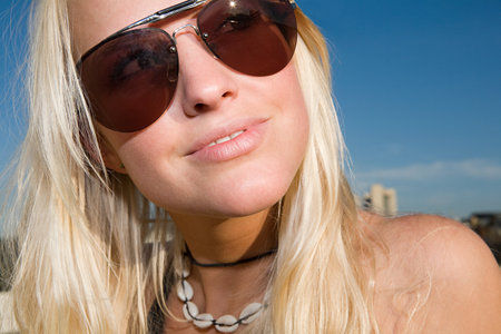 Blond woman wearing sunglassesの写真素材