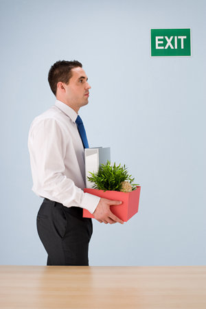 Businessman leaving jobの写真素材