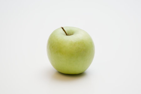 Green apple on a white backgroundの写真素材