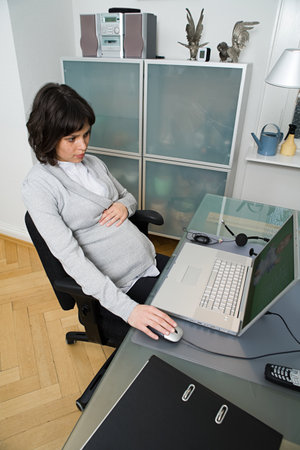 Pregnant woman telecommutingの写真素材