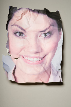 A crumpled photograph of a woman