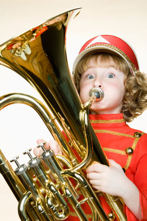 Portrait of a girl playing the tubaの写真素材