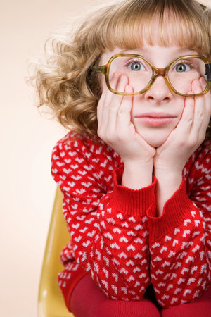 Portrait of a bored geeky girlの写真素材