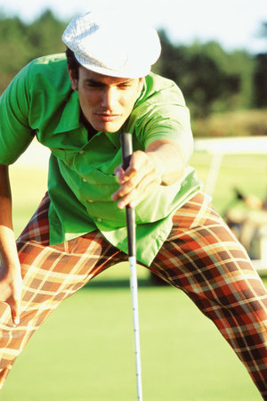 Man playing golfの写真素材