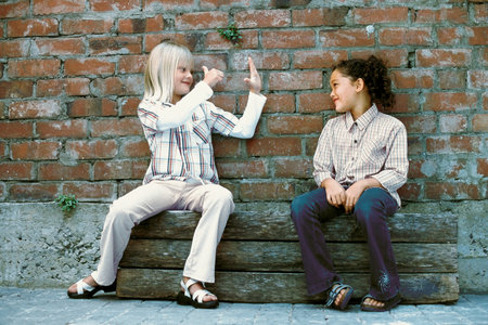 Girls talking outsideの写真素材