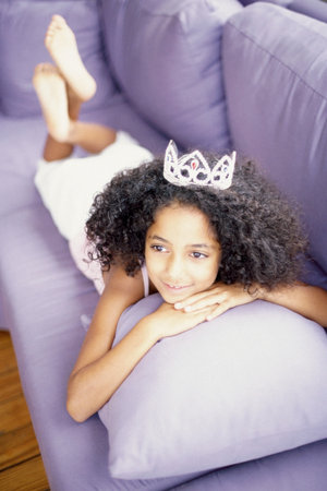 Girl lying on sofaの写真素材