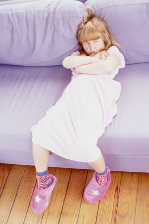 Girl sulking on sofaの写真素材