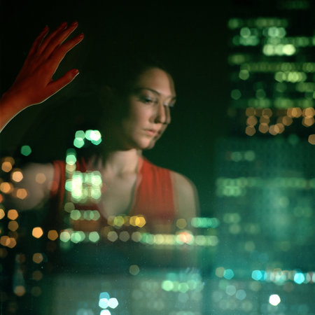 Woman reflected in windowの写真素材