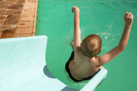 Boy enjoying waterslide