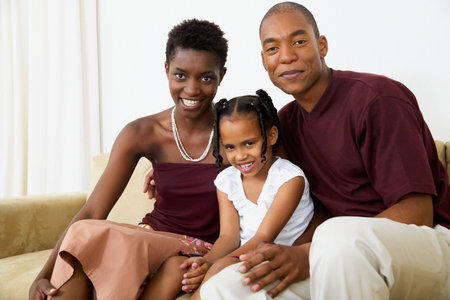Family sitting on sofaの写真素材